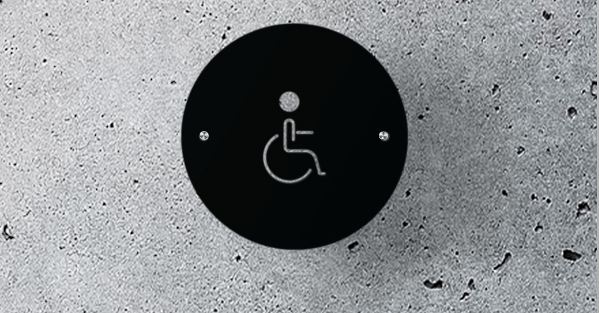 SANS compliant disabled toilet sign featuring a flat brushed aluminium wheelchair silhouette custom scaled to 110mm