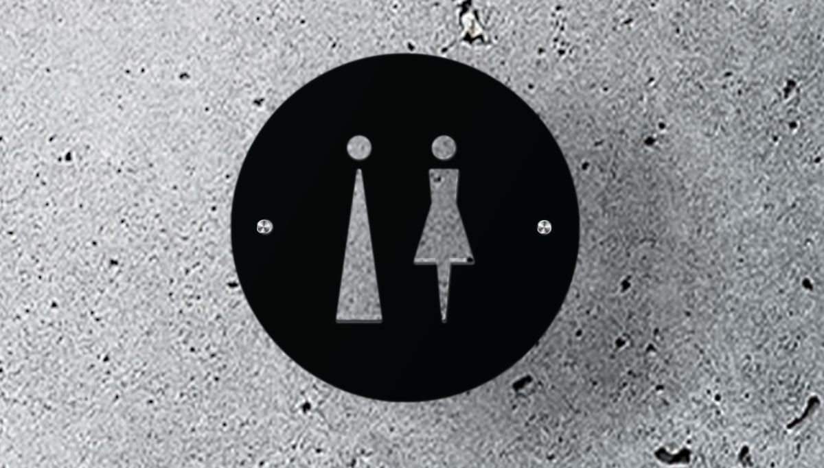 Modern office signage displaying a flat matte black unisex toilet sign with stainless steel stand offs